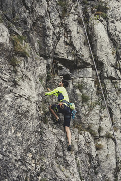 Mountaineer Climbing a Rock
