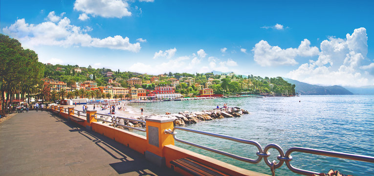 beautiful view of the sea embankment with yachts, rocky coast in the city of Santa Margarita, Italy, panorama