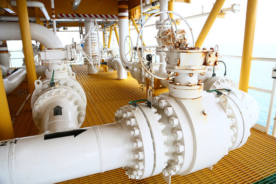 Valves manual in the process,Production process used manual valve to control the system,dirty or old manual valve,valve in oil and gas process and operated by operator,equipment in production process.