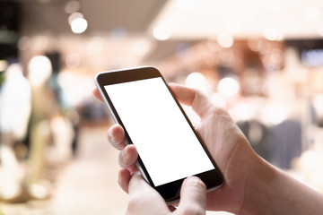Man holding smart phone with blurred background. For Graphic display montage.