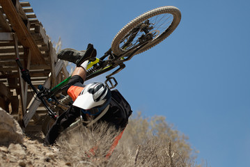 Fototapeta premium Man falls off his mountain bicycle dramatically,cyclist falls during a race