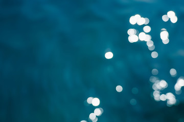 Blue sea water bokeh. Copy space for text.