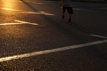 image of empty parking lot during sunset. asphalt background. © tomertu