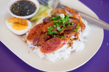 Barbecued red pork and boiled egg in sauce