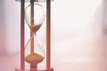 Hourglass as time passing concept for business deadline.