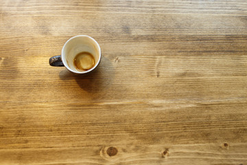 Empty coffee cut at the wooden table