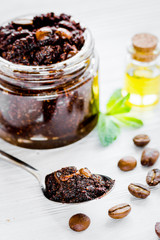 Spa concept with natural coffee scrub and oil on white backgroun