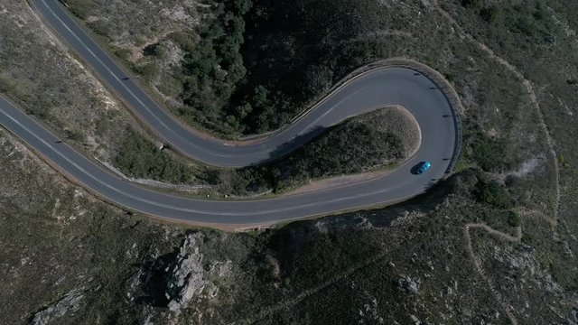 Aerial drone shot over vineyards with mountains and cloudy sky in South Africa