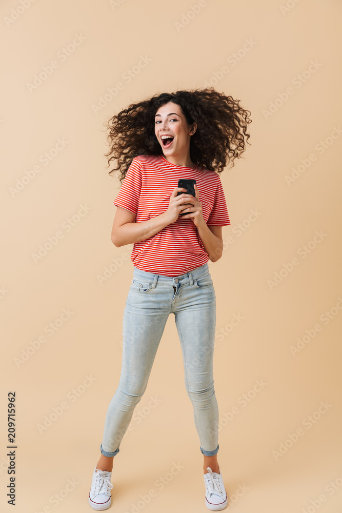 Poster Full length portrait of a cheerful casual girl