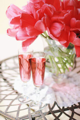 Darwin Hybrid Red Tulips in a Vase. Tulips Bouquet and Rose Сhampagne.