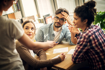 A professor is giving an assignment to a group of young cheerful students.