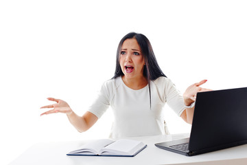 Angry businesswoman at the desk, isolated on white background