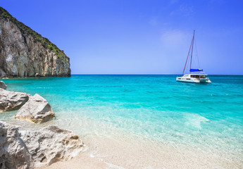 Fototapeta premium Beautiful lagoon with sailing boat and beach, Lefkada island, Greece