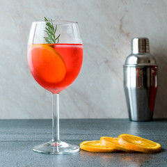 Aperol Spritz Cocktail with Orange Slice, Rosemary and Ice.