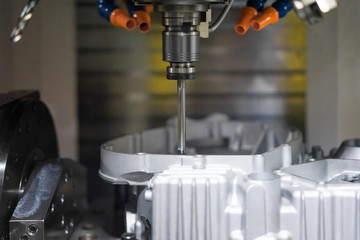 High precision CNC machining center working, operator machining automotive sample part process