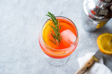Aperol Spritz Cocktail with Orange Slice, Rosemary and Ice.