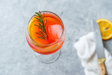 Aperol Spritz Cocktail with Orange Slice, Rosemary and Ice.