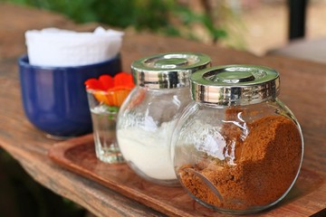 Bottles of sugar and cream