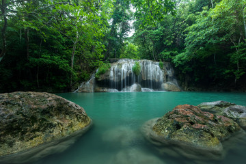 Breathtaking green waterfall at deep forest, Erawan waterfall located Kanchanaburi Province, Thailand