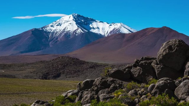 Zoom out timelapse of the mountain and clouds at the rocky desert in south of Bolivia