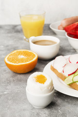 Various healthy breakfast on gray background