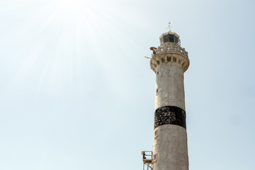 White lighthouse tower against the sky