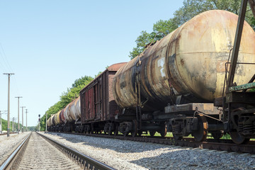Fototapeta na wymiar Freight transport by rail, cisterns, wagons