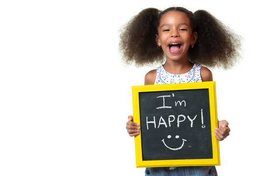 Cute African American Girl Laughing And Holding A Sign With A Happy Phrase