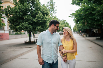 Fototapeta premium Happy couple walking in the city.