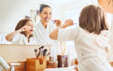 family are brushing teeth