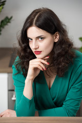 Fototapeta na wymiar portrait of young woman in a green sexy dress