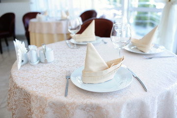 Served table in restaurant for three persons