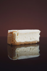 New York cheesecake on dark background
