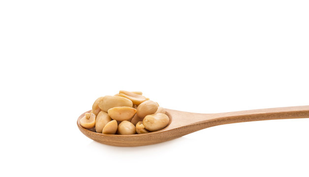 Peanuts in a Wooden spoon on white background