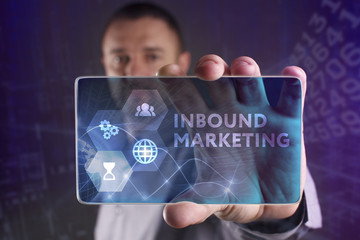 The concept of business, technology, the Internet and the network. A young entrepreneur working on a virtual screen of the future and sees the inscription: Inbound marketing