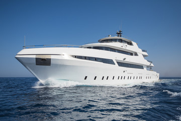 Luxury private motor yacht sailing at sea