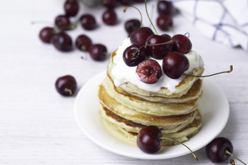 pancakes with yogurt and cherry, breakfast.