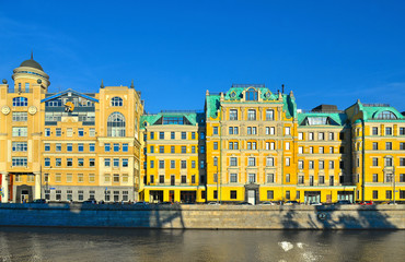 old yellow buildings and architecture on river side in old part of Moscow, Russia