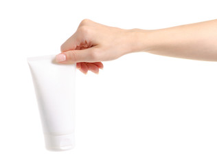 White bottle of body cream in hand on white background isolation