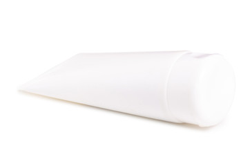 White bottle of body cream on white background isolation