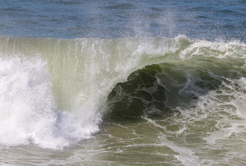 close up of blue green wave curling 