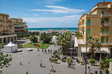 Overview of "Piazza Anco Marzio", the main square of Ostia, with the Mediterranean sea. The town is a seaside resort and ancient port of Rome. Located in the Lazio region. Central Italy.