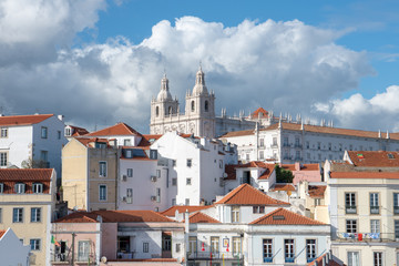 Mosteiro de Sao Vicente de Fora church and monastery above the Alfama district in Lisbon, Portugal under dramatic sky and clouds