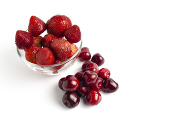 Strawberries with cherries on a white background
