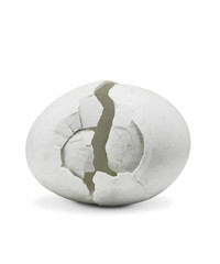 Fototapeta na wymiar Broken white eggshell on isolated white background