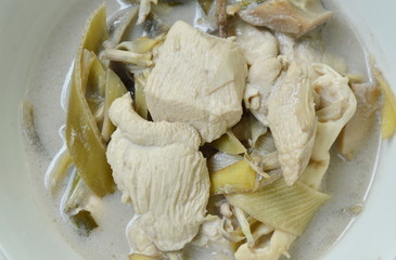 boiled chicken with slice banana blossom in coconut milk soup on bowl