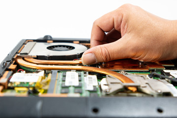 Obraz premium Computer repair technician is repairing the notebook or repair laptop.