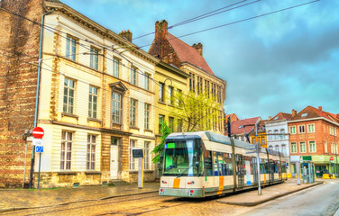 Plakat City tram in the old town of Ghent, Belgium