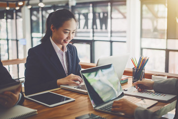 Teamwork process, business people working in the office discussing documents and ideas at meeting
