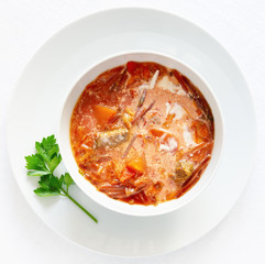 east european beetroot soup with sour cream decorated with lovage